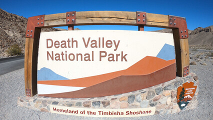 Death Valley National Park entrance sign in California, USA. Death Valley is the largest national park in the contiguous United States, as well as the hottest, driest, and lowest of all.