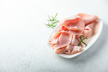 Traditional smoked ham on a white plate © marysckin