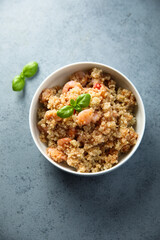 Healthy quinoa bowl with shrimps and basil