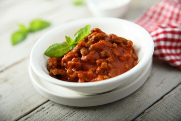 Homemade Bolognese sauce with fresh basil