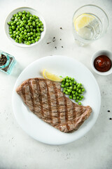 Grilled beef steak with green pea