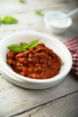 Homemade Bolognese sauce with fresh basil
