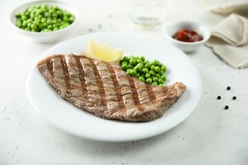 Grilled beef steak with green pea