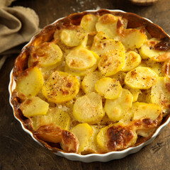 Traditional homemade potato gratin with cheese