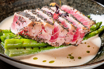 tuna steak with asparagus and sauce