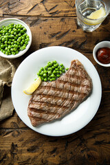 Grilled beef steak with green pea