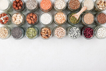 Vegan protein source. healthy vegetarian food. top view of seeds, nuts, peas, beans, rice, spelt,...