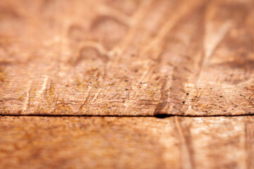 Extreme closeup of crumpled brass foil texture