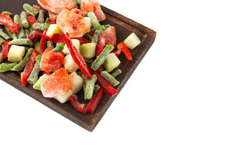 Different Frozen Vegetables, tomatoes, string beans, zucchini, red pepper on wooden cutting board, close-up. Concept - Freezing and proper defrosting of vegetables. Design element, copy space