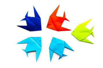 paper fish on a white background. origami concept.