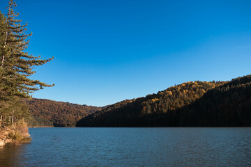 Autumn landscape shot of a lake in the mountains - Circa October 2022