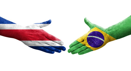 Handshake between Brazil and Costa Rica flags painted on hands, isolated transparent image.