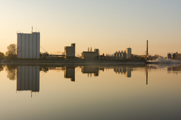 Fototapeta premium factory on the river bank