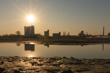 Fototapeta premium factory on the river bank