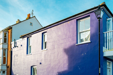 Fototapeta na wymiar Abstract view of a newly painted purple town house being renovated in a popular English seaside resort in East Anglia.