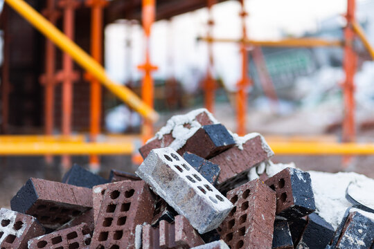Discarded bricks in pile on construction site