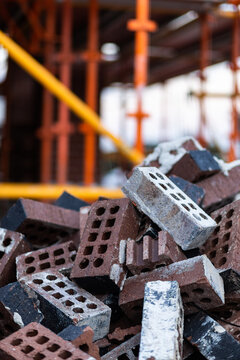 Discarded bricks in pile on construction site