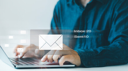 Email marketing concept, Businessman hands using Laptop surfing the internet on office with email icon, send e-mail or news letter, reading e-mail receive new message, online working internet network