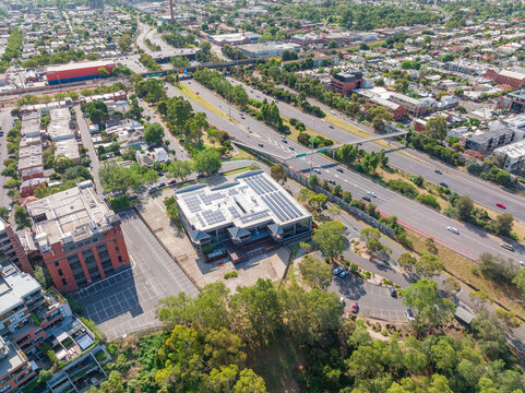 Aerial view of city buildings and and bridges on both side of a major freeway