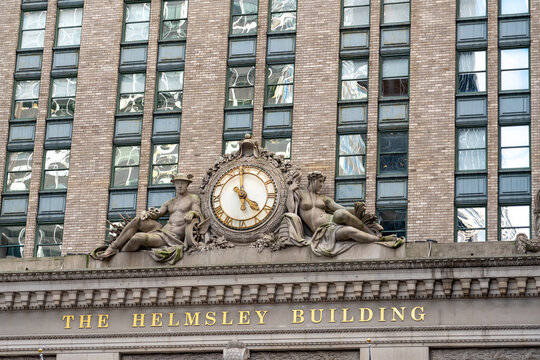 New York City, United States - September 20, 2022. Antique clock, statues and name on the Helmsley Building