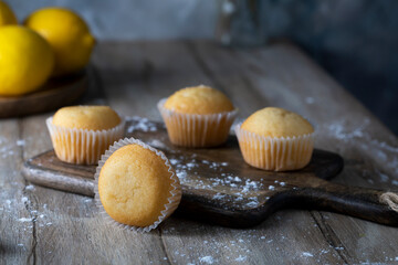 Lemon homemade cupcakes on a wooden table