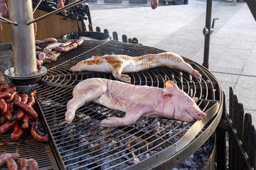Baby pigs on barbecue at traditional Spanish market in Torrevieja, costa Blanca