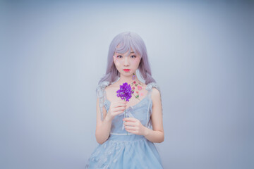 A girl with petals on her body