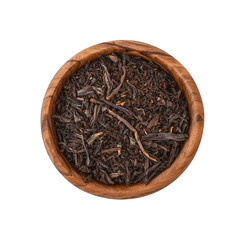 Dry tea leaves in wooden bowl