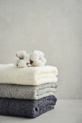Stack of bath towels with cotton flowers - 538385935