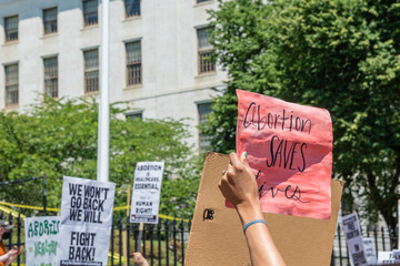 Boston, MA, US-June 25, 2022:  Protests holding pro-abortion signs at demonstration in response to...