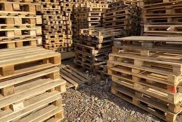 Lots of wooden pallets. Stacks of pallets