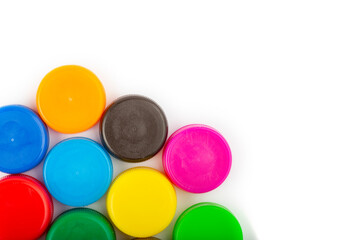 Сolorful plastic caps on white background, recycle for environment concept. Separate waste sorting. Space for text.