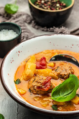 stew vegetables with meatballs on a dark background, Delicious balanced food concept, place for text, top view