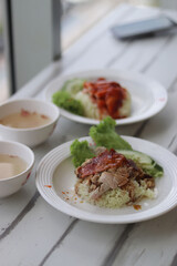 steamed rice topped with chicken 
