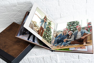 christmas and young family in retro photo book