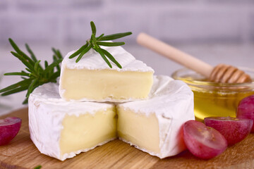 Camembert cheese and grapes.Close-up.
