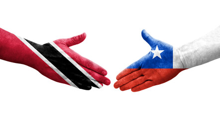 Obraz premium Handshake between Chile and Trinidad Tobago flags painted on hands, isolated transparent image.
