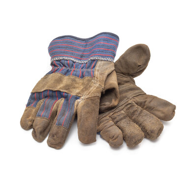 Used and dirty work gloves on white
