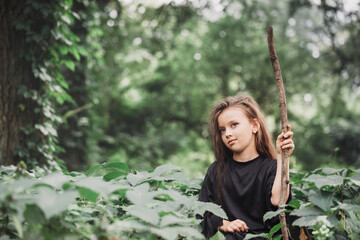 A young witch with a staff