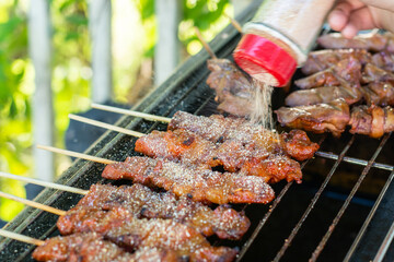 Chef prepares food for sale to customers
