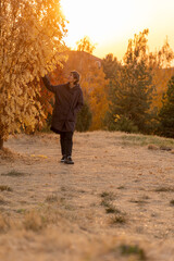 person walking in autumn park