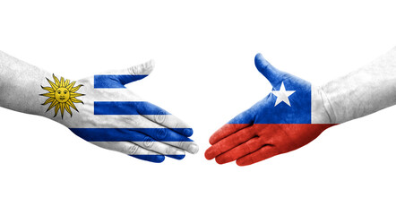 Handshake between Chile and Uruguay flags painted on hands, isolated transparent image.