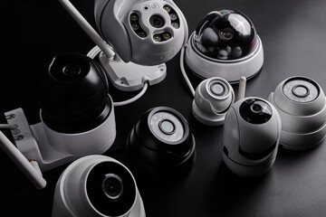 Surveillance cameras, set of different videcam, cctv cameras isolated on black background close up....