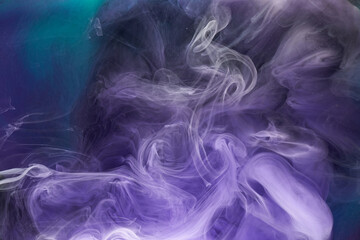 Purple lilac multicolored smoke abstract background, acrylic paint underwater explosion