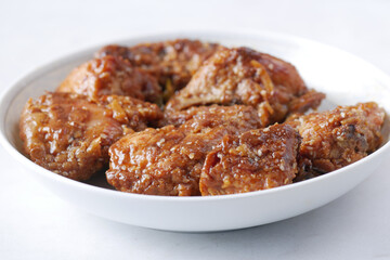 close up of slice of grill chicken on a plate 