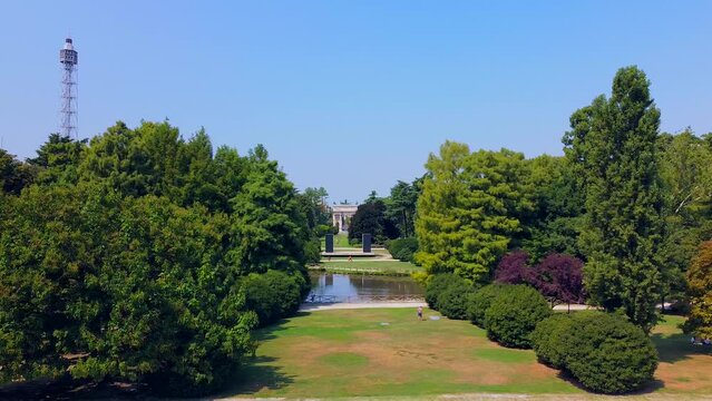 Gate Sempione Porta Sempione city gate to Lombardy in the fall. Arch of Peace. Arco della pace. sunny evening in milan city park aerial panorama 4k italy milano city triumphal arch. Sculptures