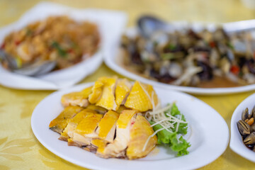 Chinese style food of steamed chicken and braised clam