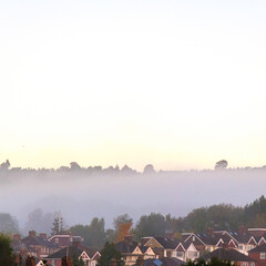 Morning Mist Or Fog Over Traditional Residential Housing Estate