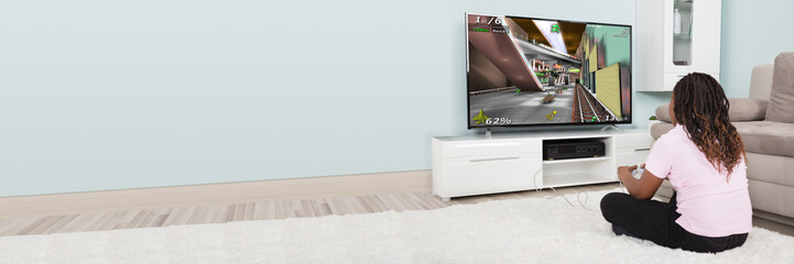 An African Girl Playing Video Games