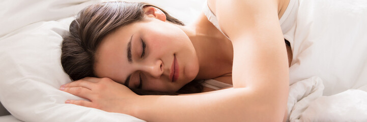 Obraz na płótnie Canvas Beautiful Woman Sleeping On Bed